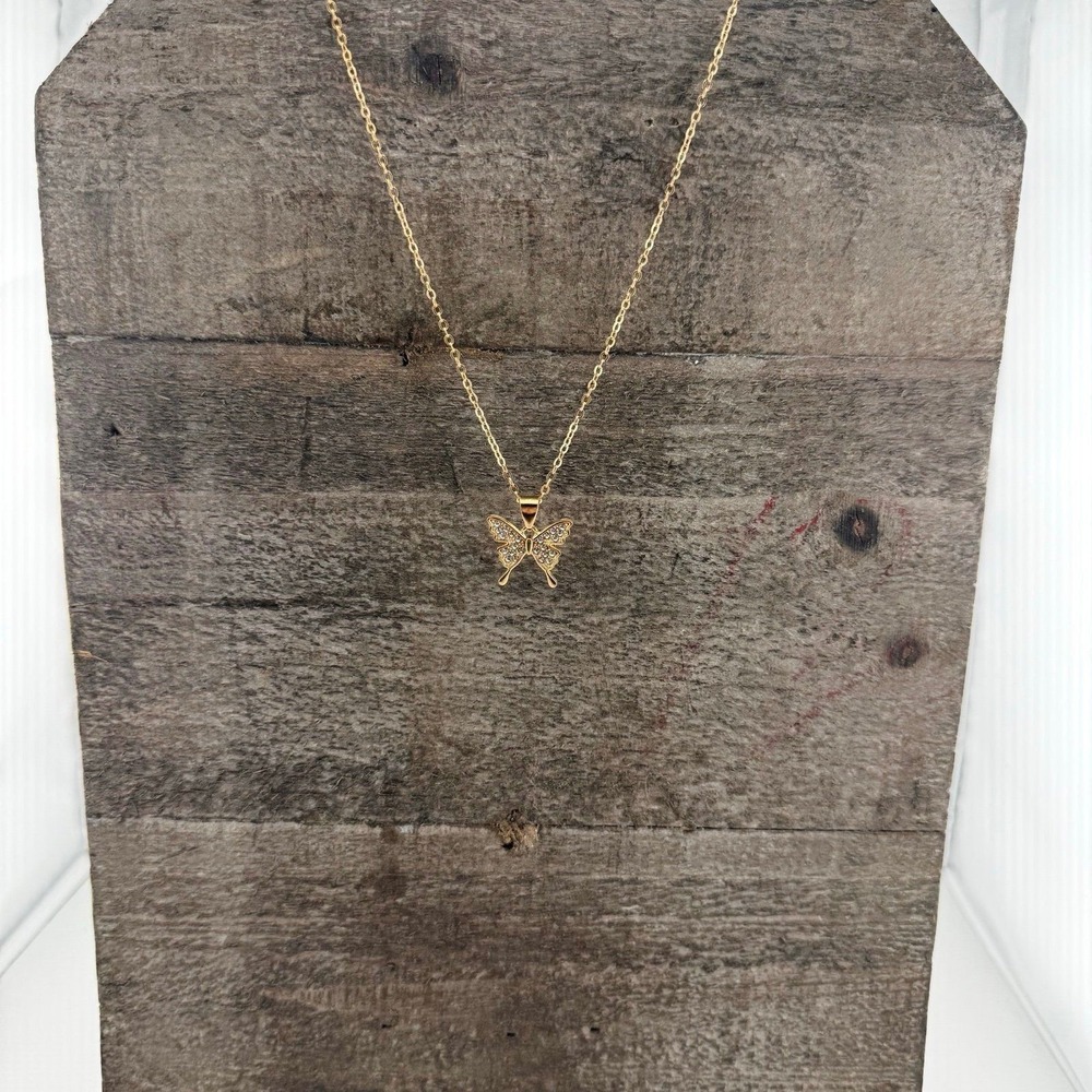 Goldtone butterfly pendant necklace with crystal inlay. 8" chain.